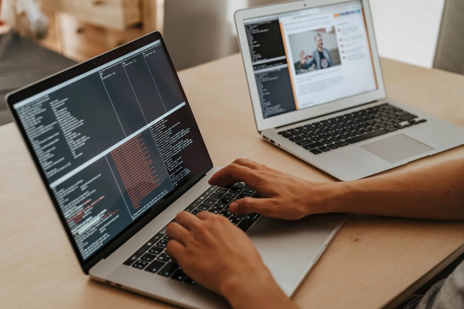 A developer working on a laptop, typing code, showcasing programming and technology skills.